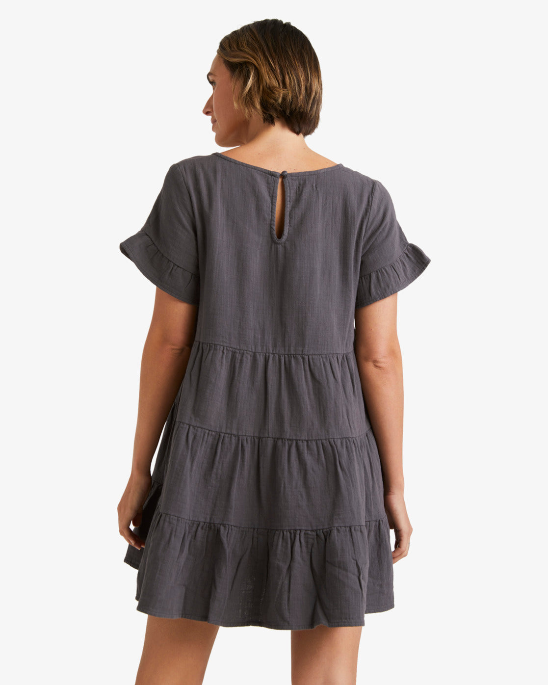 Billabong Pixie Dress in washed black on model from rear