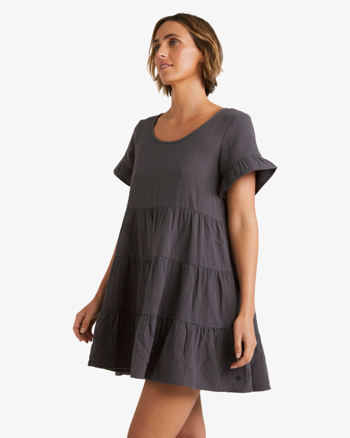 Billabong Pixie Dress in washed black on model from side