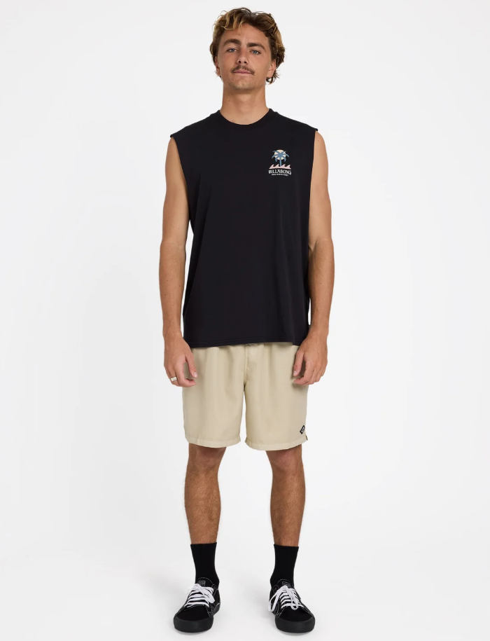 Billabong Portal Muscle Top in black on model in stone coloured shorts form the front