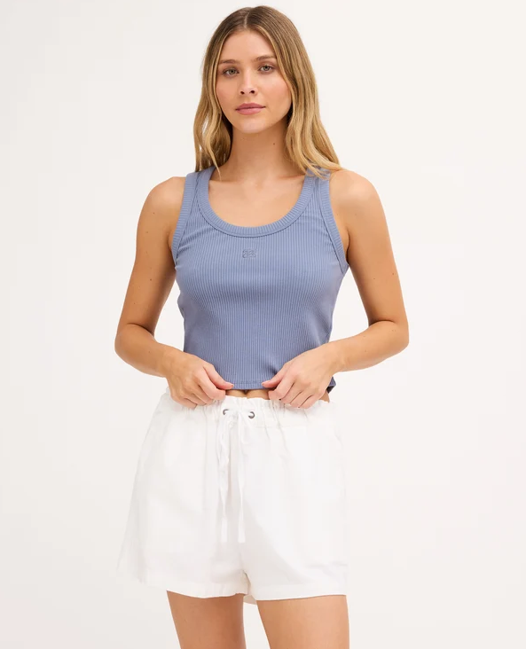 Billabong Rerun Women's Tank in blue smoke colourway on model in white shorts from the front close up