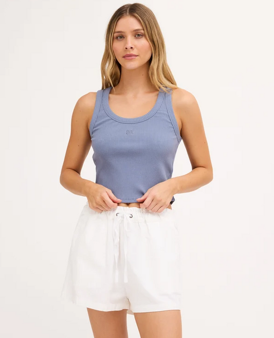 Billabong Rerun Women's Tank in blue smoke colourway on model in white shorts from the front close up