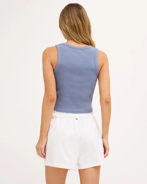Billabong Rerun Women's Tank in blue smoke colourway on model in white shorts from the rear