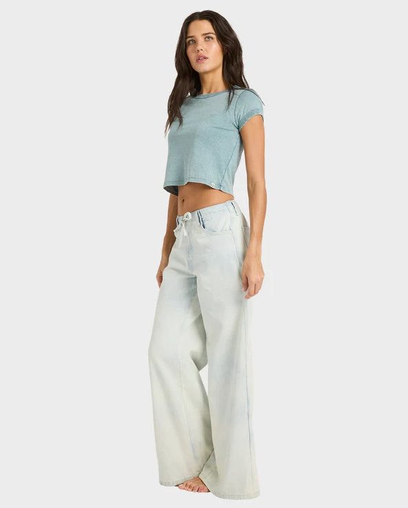 Billabong Jade Saltwashed Elastic Pants in blue mist on model in light blue tee from side view