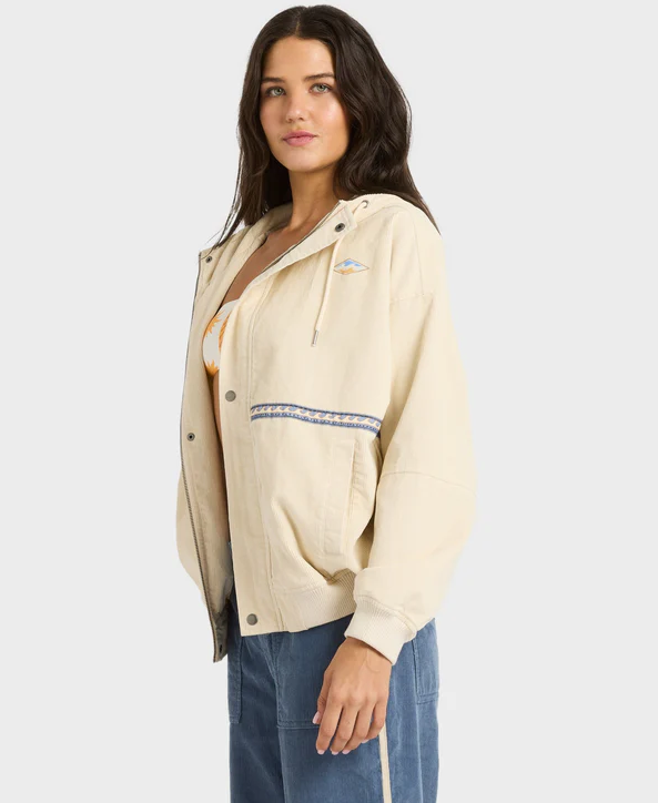 Billabong Set The Tone Women's Cord Jacket in white cap colourway on model in blue cord pants and bikini top close up from side