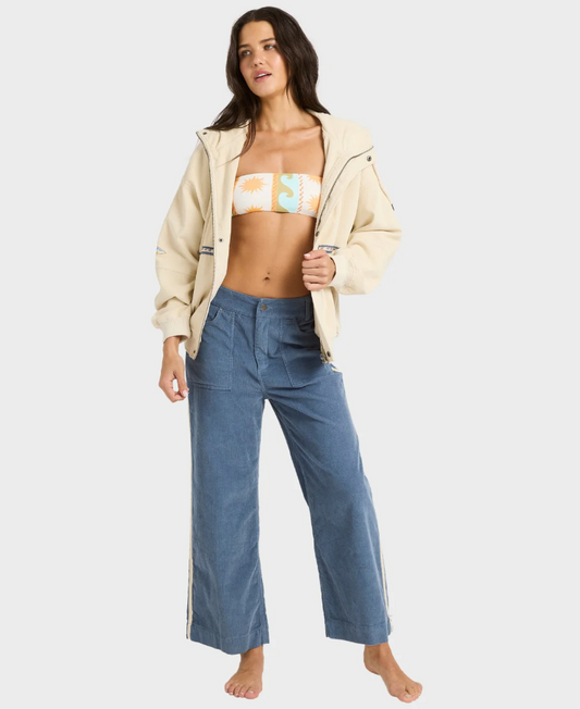 Billabong Set The Tone Women's Cord Jacket in white cap colourway on model in blue cord pants and bikini top form front