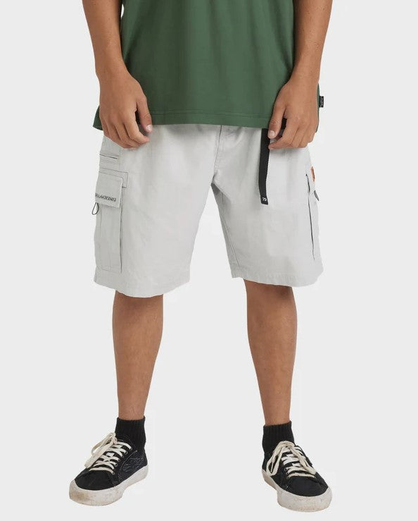 Billabong Spec 73 22" Cargo Shorts in silver colourway on model in green tee from close up