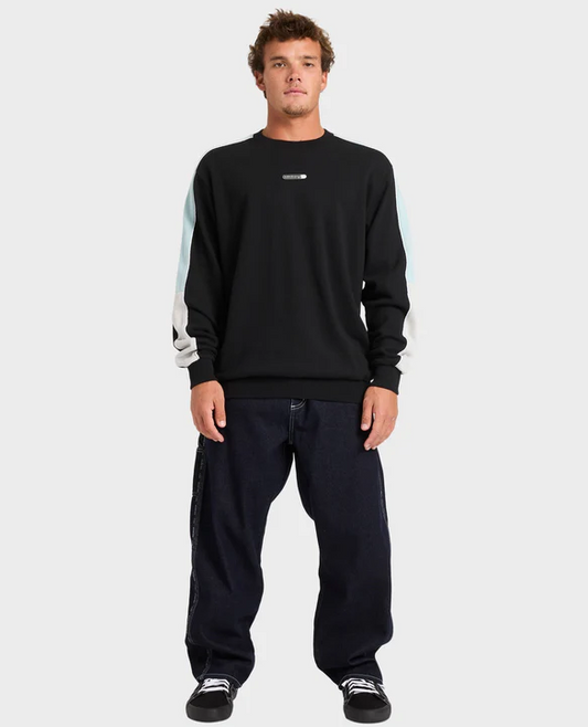 Billabong Spec 73 Chrome Denim Jeans in black on model in Billabong crew from front
