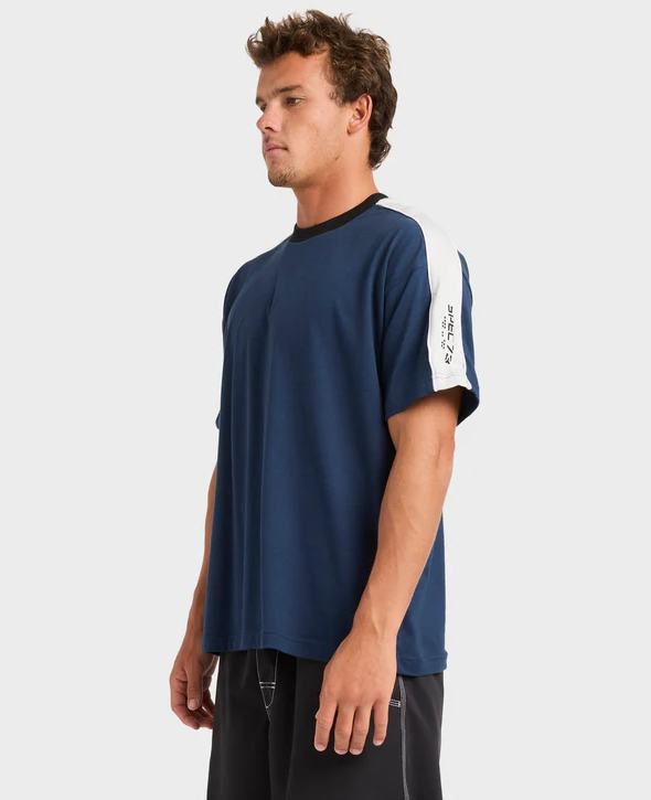 Billabong Spec 73 Iconic Men's Tee in vintage indigo on model from side