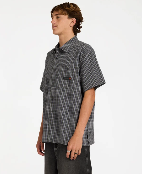 Billabong Spec Mogul Short Sleeve Shirt in forest and black check on model from the side