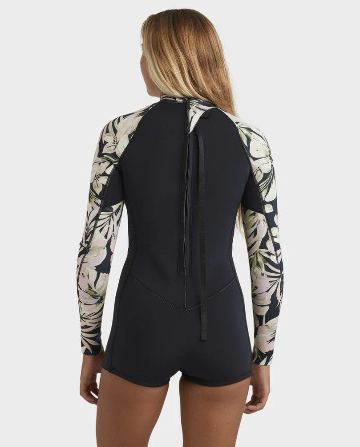 Billabong Spring Fever Natural Long Sleeve Womens Shorty Wetsuit n black with floral arms on blonde model from rear