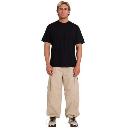 Billabong Strike Mission T-Shirt in black on model in cargo pants from the front