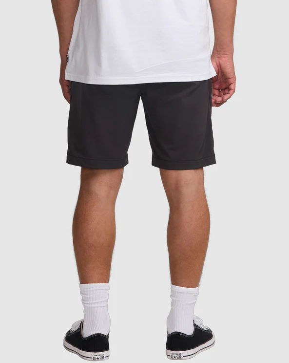 Billabong Surftrek Journey Hybrid Shorts in black on model in white tee from rear