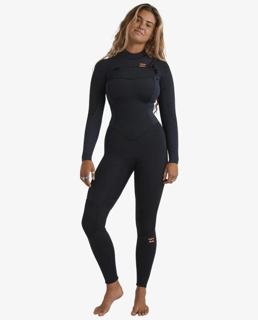 Billabong Synergy Natural 3/2mm Chest Zip GBS Womens Wetsuit in black with geometric patterns on model from front