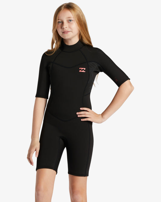 Girl wearing the Billabong Teen Synergy 2mm Spring Wetsuit in black