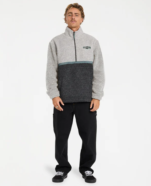Billabong Tombstone Half Zip Pullover Fleece in oatmeal heather colourway from front on model in black jeans