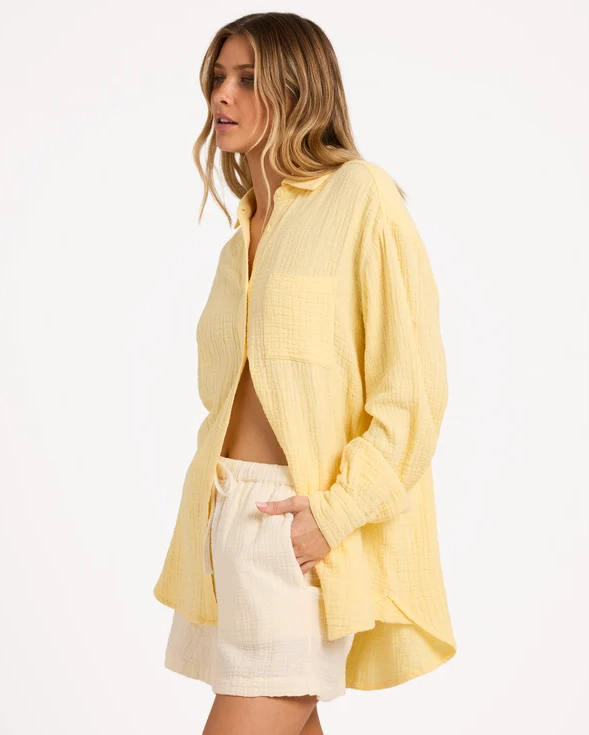 Billabong Wanderer Long Sleeve Shirt in sunlight on model in whtie shorts from side