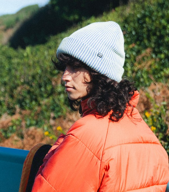 Billabong Wave Check Women's Beanie in iris light blue colourway on model in orange jacket