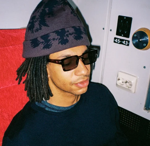 CHPO Brand Stellar Sunglasses in turtle grey on model with dreadlocks in a beanie