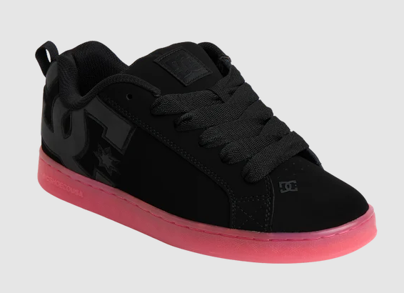 DC Shoes Women's Court Graffik Shoes in black with pink soles from the side on an angle