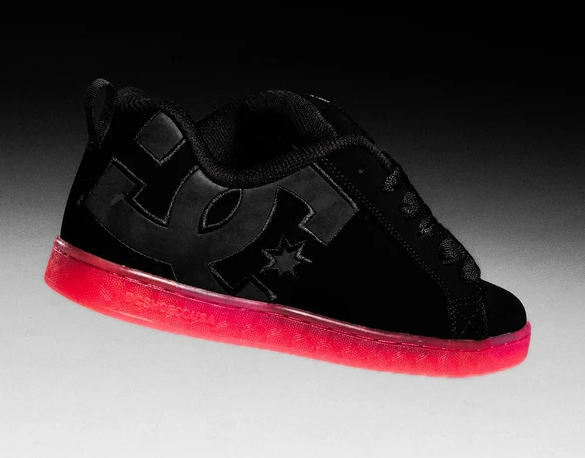 DC Shoes Women's Court Graffik Shoes in black with pink soles from the side