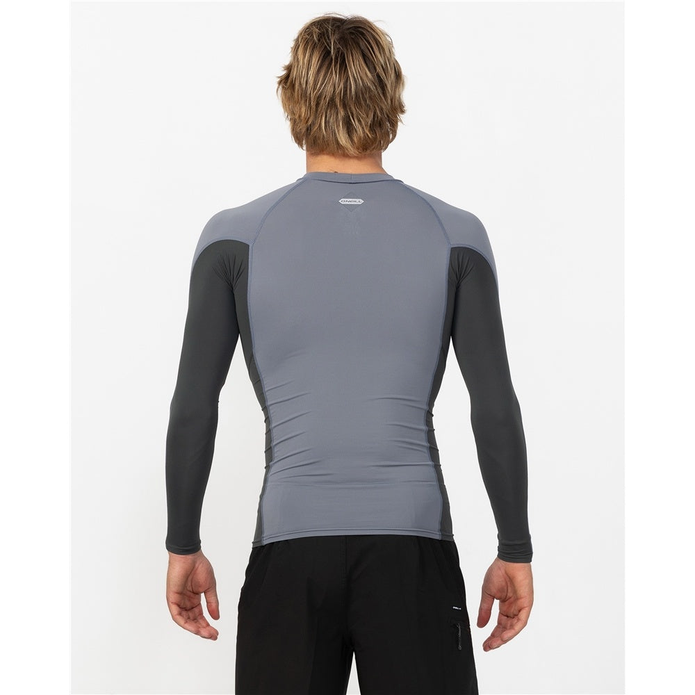 O'Neill Hyperfreak Skins Long Sleeve Rash Guard in dark shadow colourway on model in black boardshorts from back close up