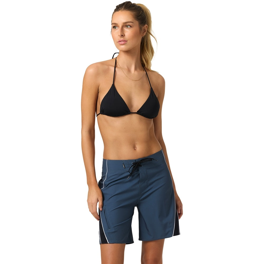 O'Neill Y2K Superfreak 7" Women's Boardshorts in slate colourway on model in black bikini top from front
