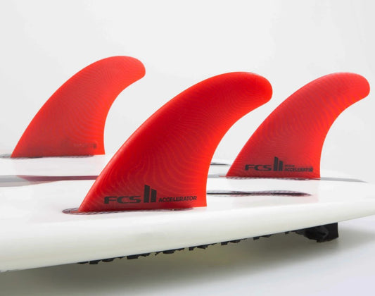 FCS II ACCELERATOR Neoglass MED ECO TRI FIN SET in surfboard in red colourway