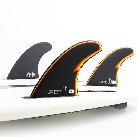 FCS II GL Gerry Lopez Tri Fin Set showing three fins in a surfboard