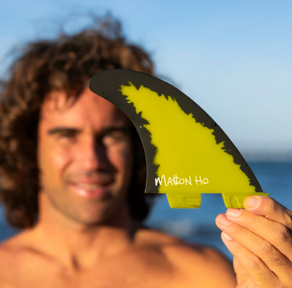 FCS II MH Mason Ho PC Aircore Surfboard Fins in yellow and black held by Mason