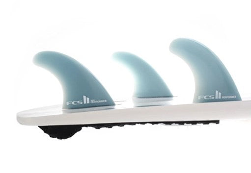 FCS II Performer Glassflex Tri Surfboard Fin Set - med in a surfboard tail