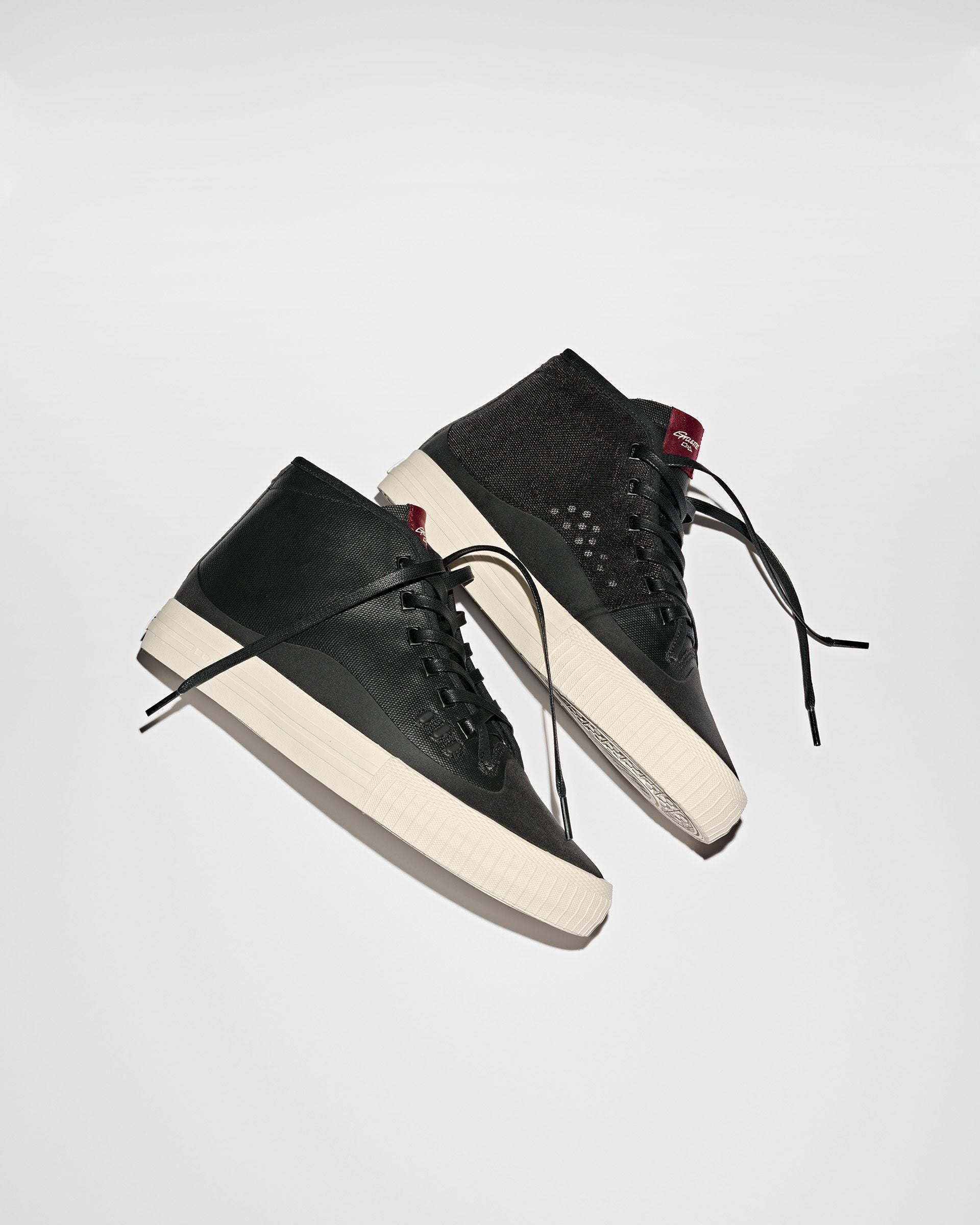 Black mid top skateboard shoes called the Globe Gillette Mid Shoes