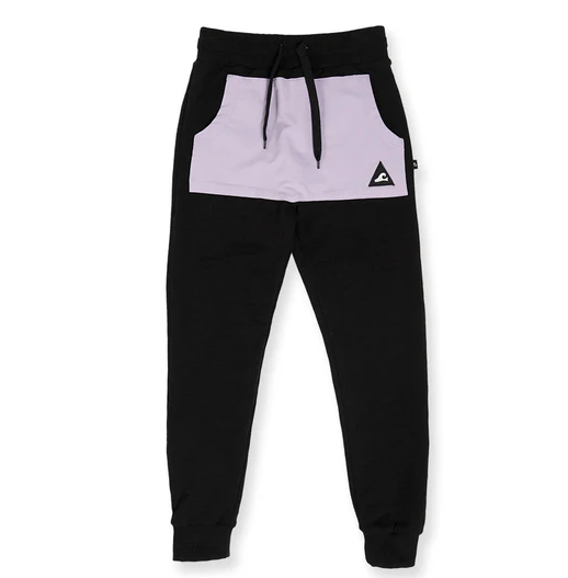 Hello Stranger Boys Pocket Track Pants in black with lavendar pocket from front flatlay on white background