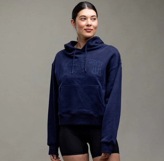 ilabb Varsity Extra Womens Hoodie in navy with embroidered logo from front on model