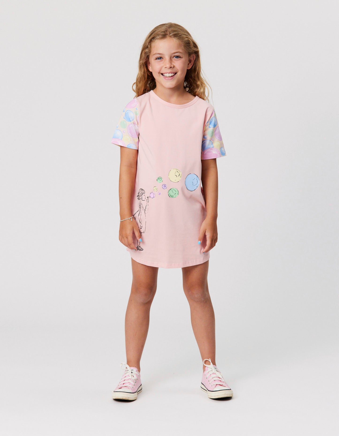 Kissed By Radicool Bubble Skater Tee Dress in pale pink on model from front