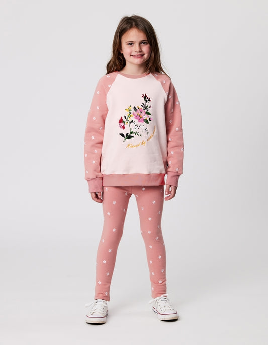 Kissed By Radicool Flora Raglan Crew in pink with a floral chest print from front on model