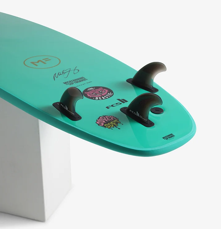 Mick Fanning 7'0 Beastie Supersoft Softboard in aquamarine colour showing the fins