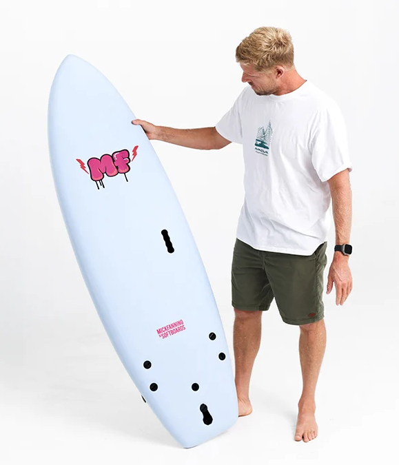 Mick Fanning 5'10 Unicorn Supersoft Softboard in sky blue colourway held by mick fanning