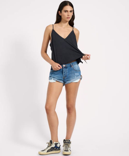 One Teaspoon Pacifica Bandit Low Waist Denim Shorts on model in black tank from front