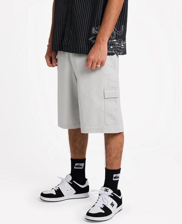 Quiksilver 04S 21" Cargo Shorts in grey on model in pinstripe shirt from the side