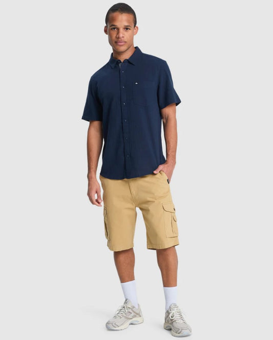 Quiksilver Crucial Battle Cargo Shorts in khaki from front on model in blue shirt