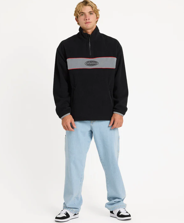 Quiksilver Mercury Panel Men's Polar Fleece in black on model in blue jeans from front