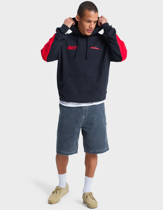 Quiksilver Mercury Trident Hoodie in black wirth red detailing on model in blue Quiksilver shorts