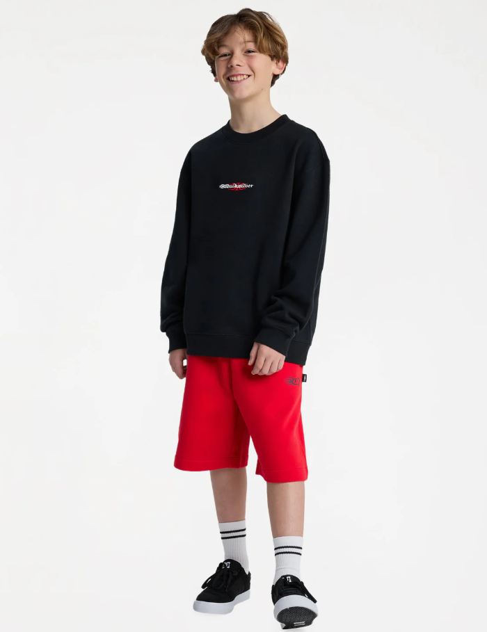 Quiksilver Mercury Trident Youth Crew in black on model in red shorts from front