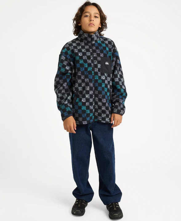 Quiksilver Next Gen Youth Polar Fleece in black and multi colour on young model in blue jeans
