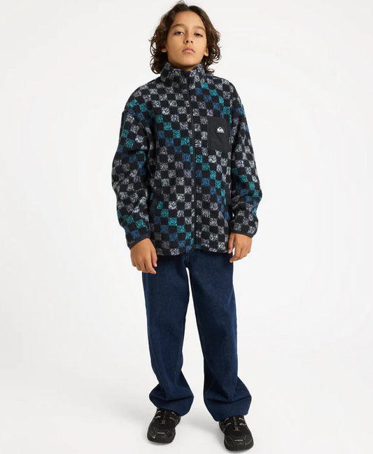 Quiksilver Next Gen Youth Polar Fleece in black and multi colour on young model in blue jeans