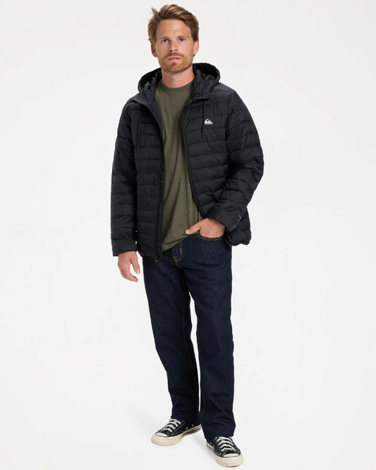 Quiksilver Scaly Hooded Puffer Jacket in black on model in indigo jeans from front