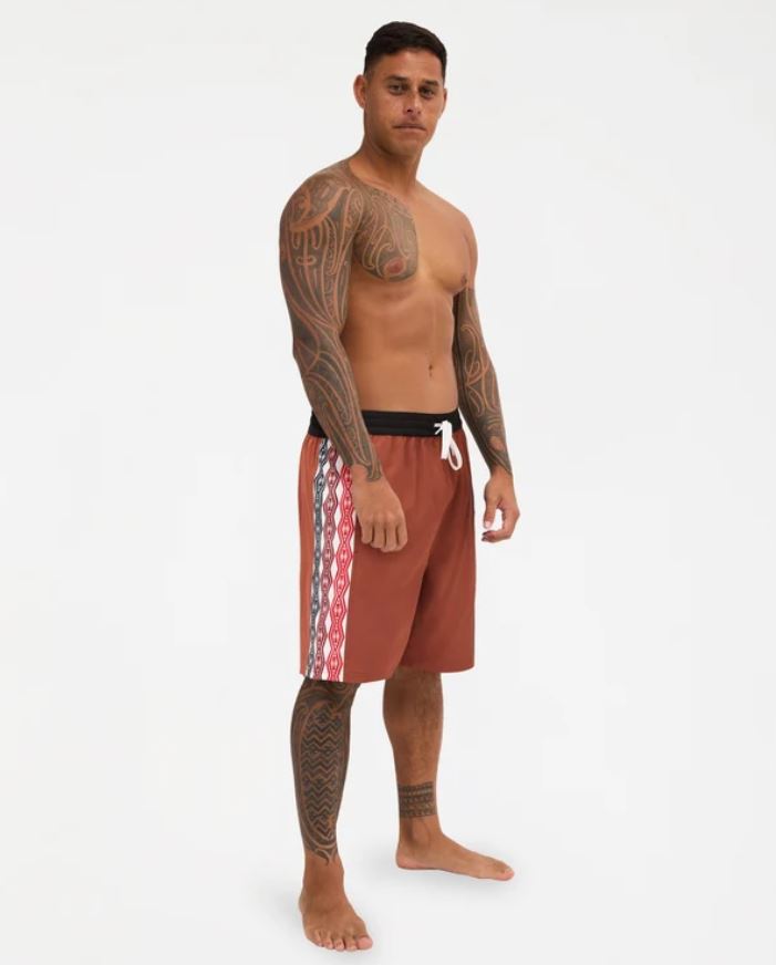 Quiksilver Tai Kehu Arch 18" Maori Volley Shorts in henna colourwya on Kehu Butler from the front/side view