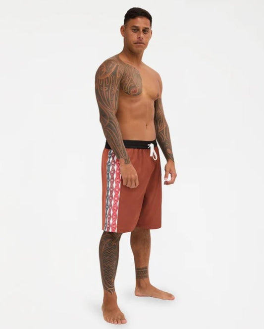 Quiksilver Tai Kehu Arch 18" Maori Volley Shorts in henna colourwya on Kehu Butler from the front/side view