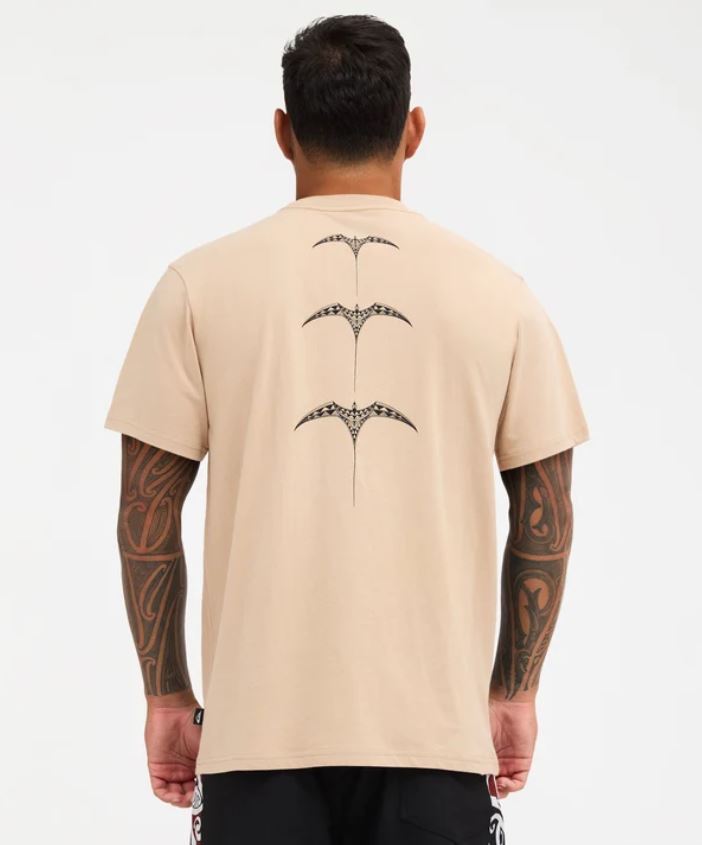 Quiksilver Tai Kehu Manu T-Shirt in light khaki on Kehu Butler from the back