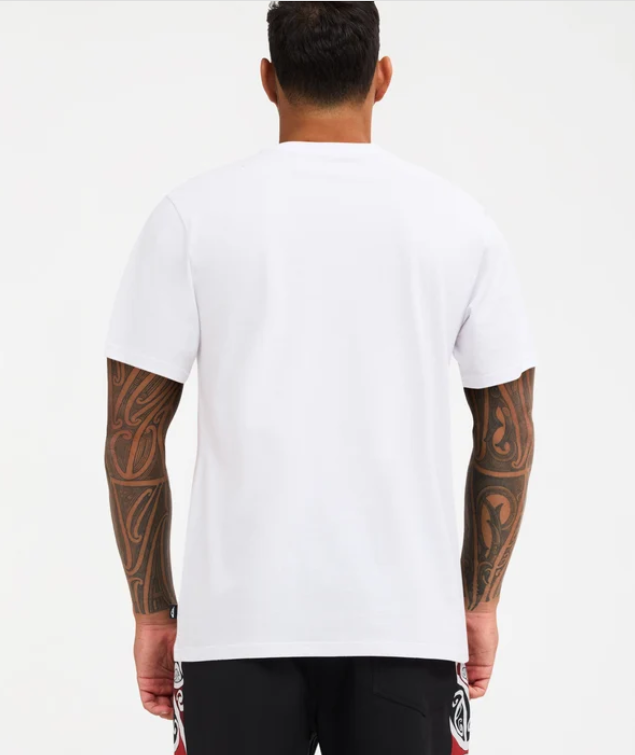 Quiksilver Tai Kehu Marakihau Men's Maori T-Shirt in white on Kehu Butler in Quiksilver Maori boardshorts from the back
